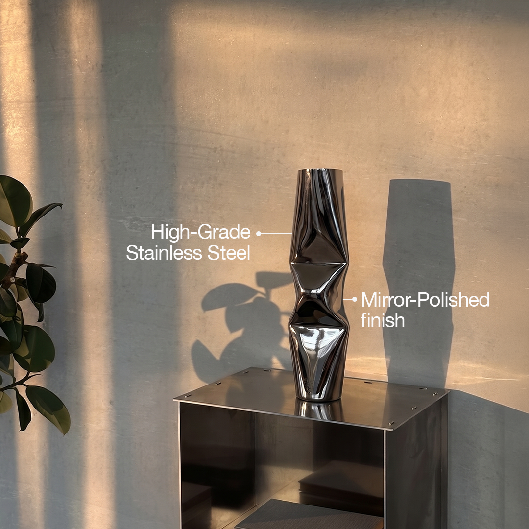 Large chrome dented stainless steel vase
