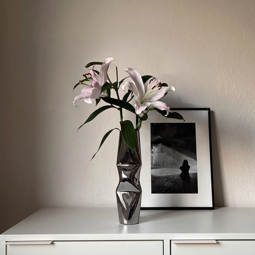 Chrome sculptural vase for home decor
