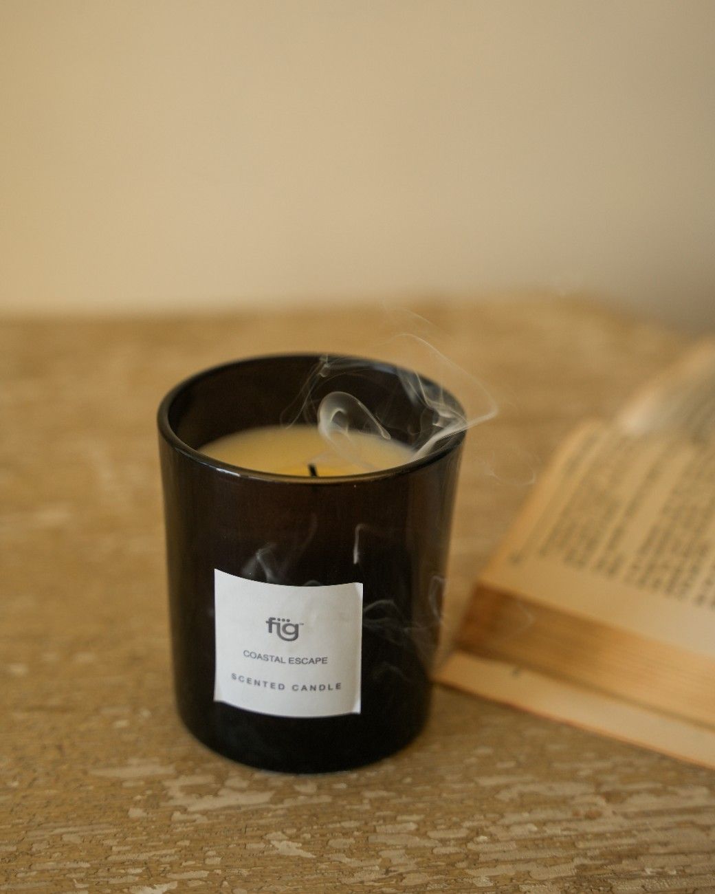 candle on the table with book