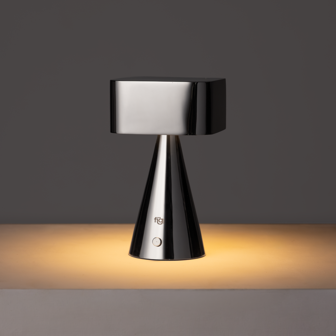 Illustration highlighting chrome portable lamp in stainless steel with modern minimalist design and soft ambient LED lighting