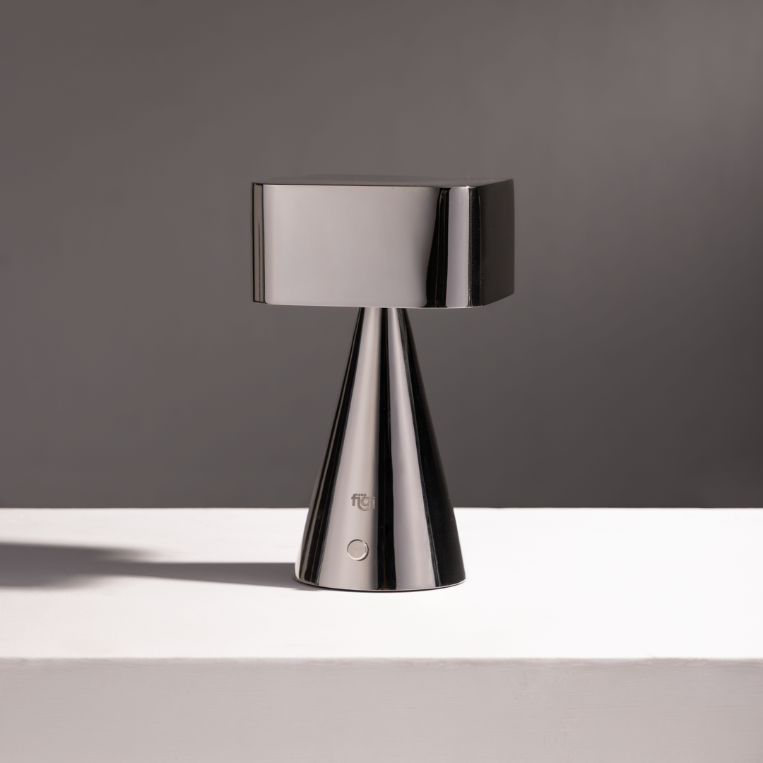 Illustration showcasing stainless steel chrome portable table lamp placed on modern bedside décor setup