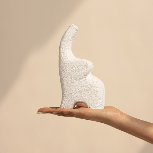 white elephant showpiece bookshelf styling