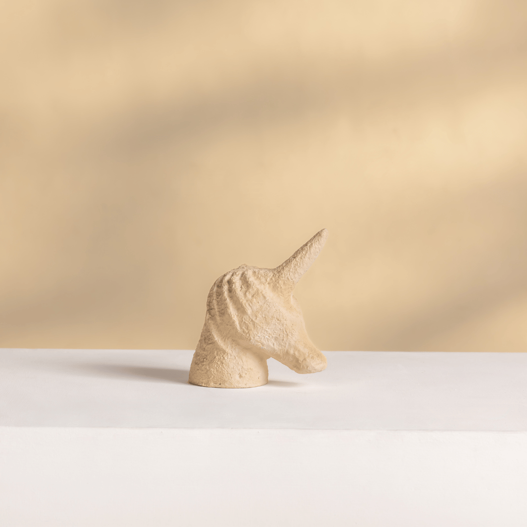 beige unicorn figurine home decor